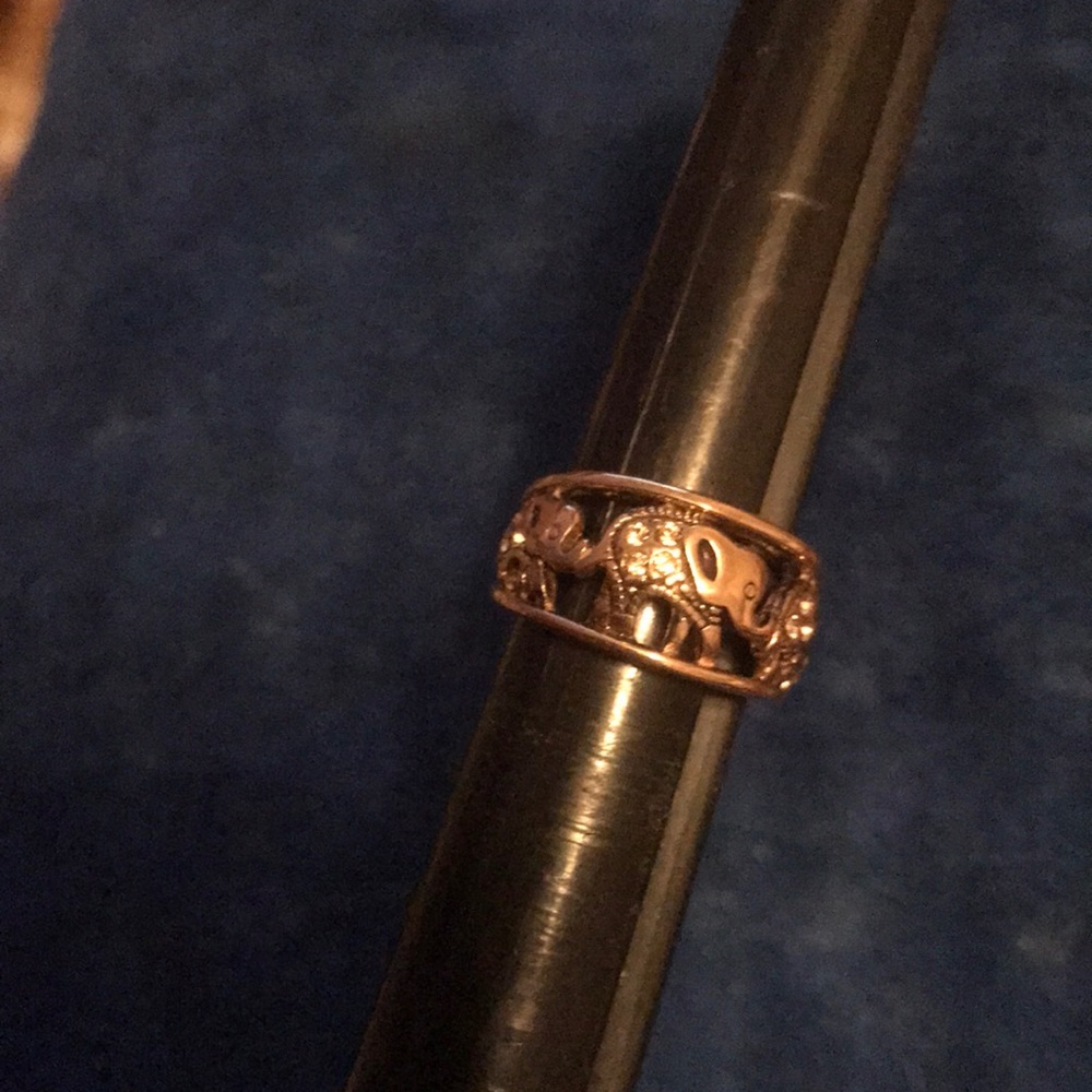 Cute qvc rose gold and topaz elephant ring.